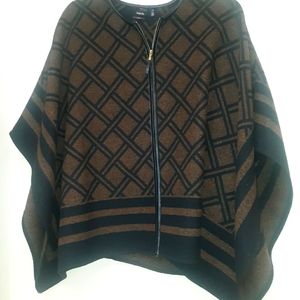 Poncho with faux leather trim